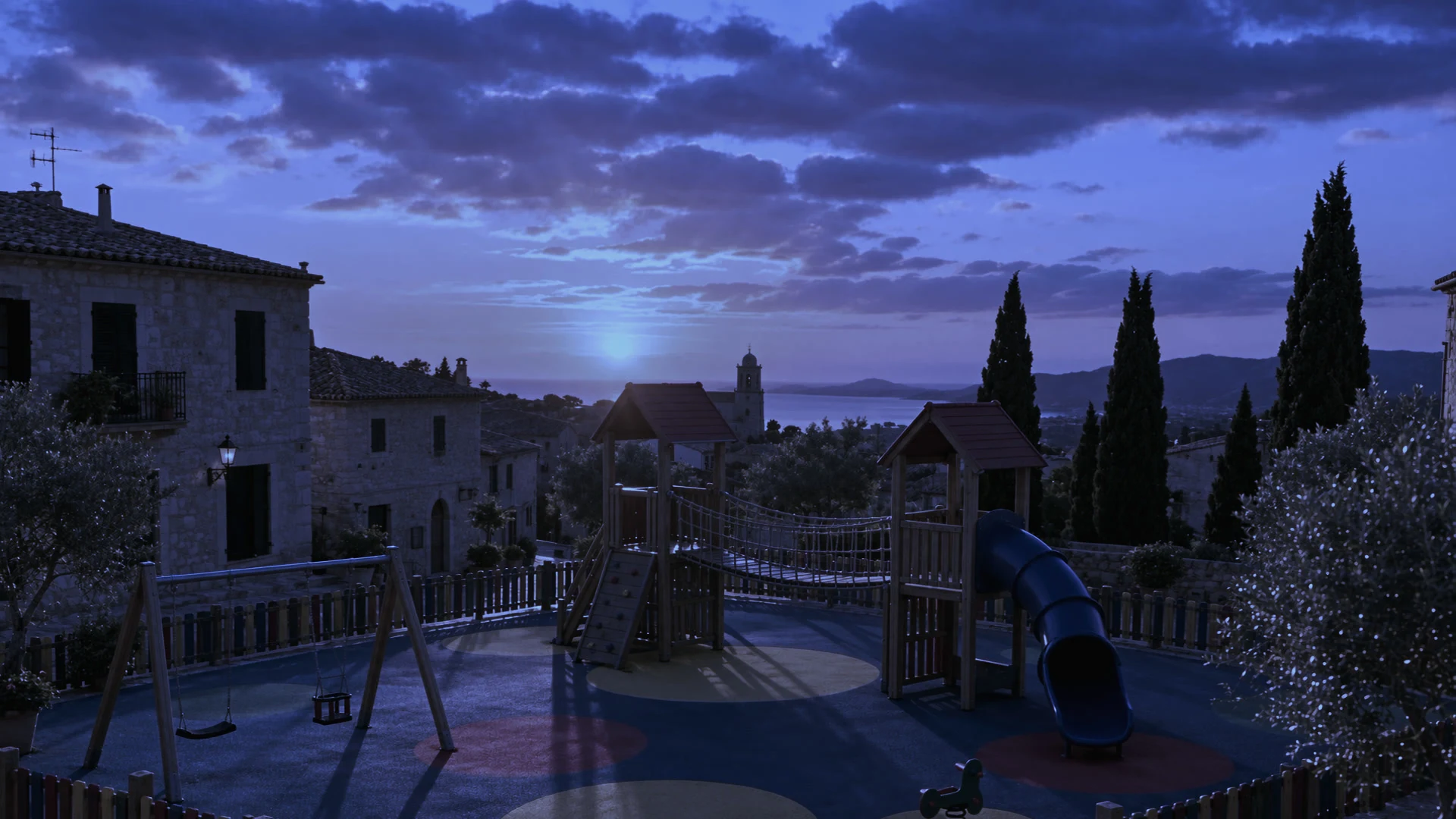 Visualización con IA de un parque infantil de madera con caucho de colores en una plaza de piedra de Mallorca al atardecer